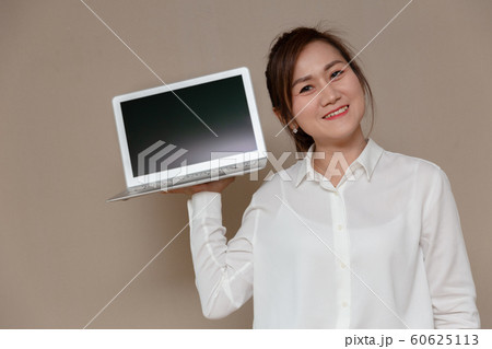 Asian woman smiling single handle computer laptop 60625113