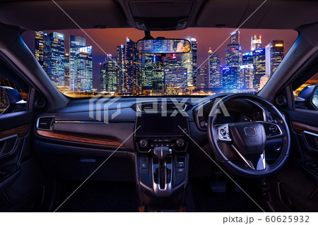 Looking through a car windshield with cityscape at night. Travel in car. 60625932