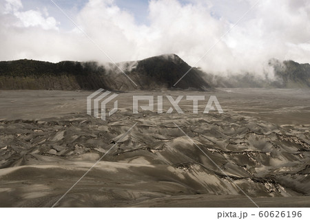 Volcanic Ash Shaping The Arid Landscape Around The Bromo Volcano In Java, Indonesia Volcanic Ash Shaping The Arid Landscape Around The Bromo Volcano In Java, Indonesia 60626196