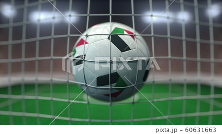 Football with flags of Sudan in net against blurred stadium. 3D rendering Football with flags of Sudan in net against blurred stadium. 3D rendering 60631663