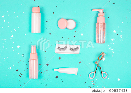 Care cosmetics on a trendy green background. Care cosmetics on a trendy green background. 60637433