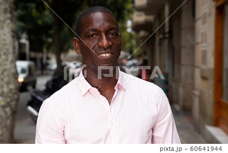 Cheerful man enjoying walk 60641944