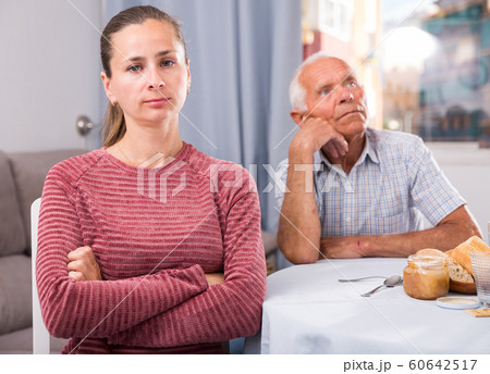 Adult daughter quarreled with her elderly father 60642517