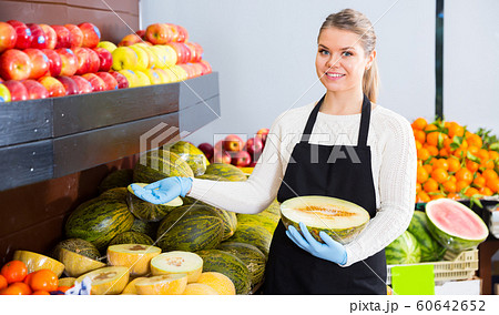Adult female selling melon and other fruits 60642652