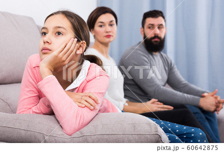 Parents lecturing daughter 60642875
