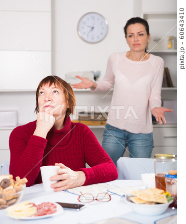 Two women having serious quarrel and talking 60643410
