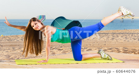 Portrait of sportswoman which is doing excercises on endurance Portrait of sportswoman which is doing excercises on endurance 60644076