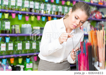 Woman looking for incense sticks 60644833