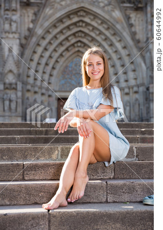 Girl sitting on stairs of temple Girl sitting on stairs of temple 60644992