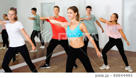 Teenage dancers practicing active vigorous dance in modern studi 60644993
