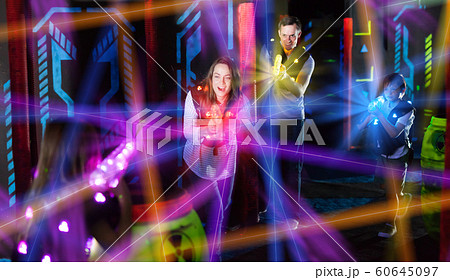 Parents and children playing laser tag in beams Parents and children playing laser tag in beams 60645097