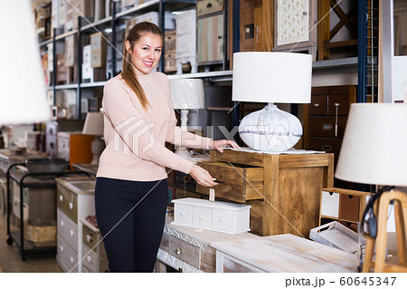 Female choosing commode in store Female choosing commode in store 60645347