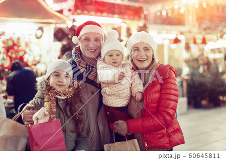 Parents and daughters at Christmas fair Parents and daughters at Christmas fair 60645811