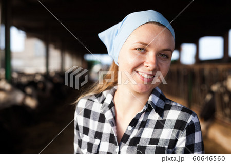 Female farmer on dairy farm Female farmer on dairy farm 60646560