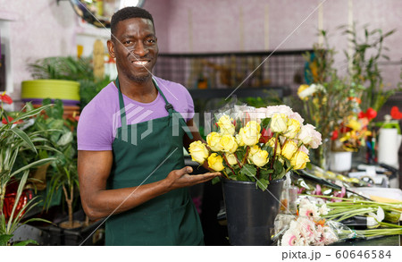 Florist offering roses Florist offering roses 60646584