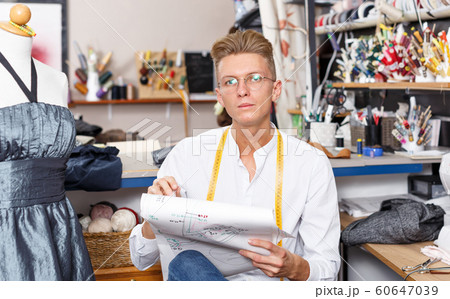 Dressmaker at work – creating dress style 60647039