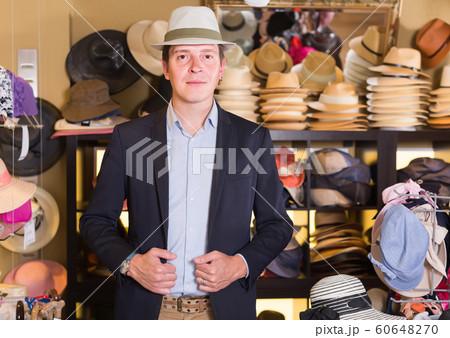portrait of male try on cap at the shopping mall portrait of male try on cap at the shopping mall 60648270