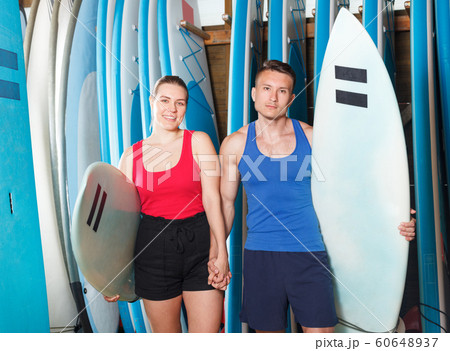 male and girl with boards for surfing 60648937