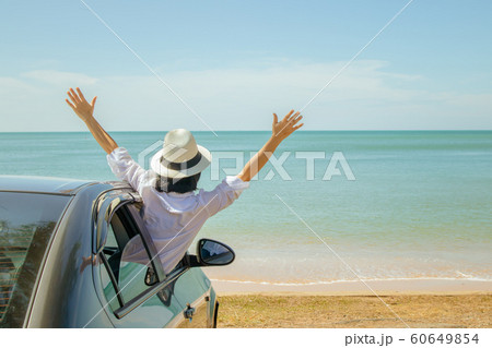 Family car trip at the sea, Asian woman feeling happiness. Family car trip at the sea, Asian woman feeling happiness. 60649854