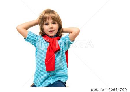 Sports teenager boy in t-shirt with hoody around his neck gesticulates isolated on blue background 60654799