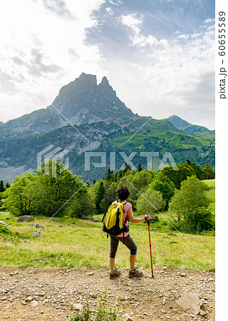 woman hiker with Pic du Midi d'Ossau in the French woman hiker with Pic du Midi d'Ossau in the French 60655589