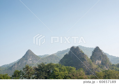 Karst formation and foggy mountain landscape between Guiling and Yangshuo Karst formation and foggy mountain landscape between Guiling and Yangshuo 60657189