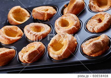 close-up of Yorkshire puddings in a baking tray 60658408