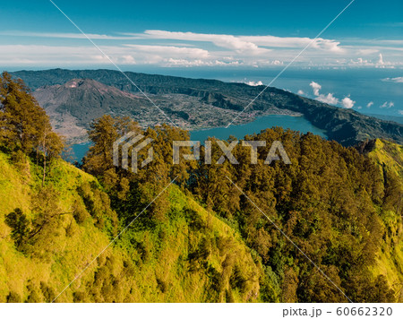Aerial view of Batur volcano and lake with forest, Bali Indonesia 60662320