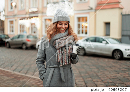 Happy woman in vintage coat  60663207