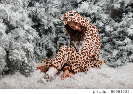 Beautiful young happy girl in funny bear pajamas Beautiful young happy girl in funny bear pajamas 60663585
