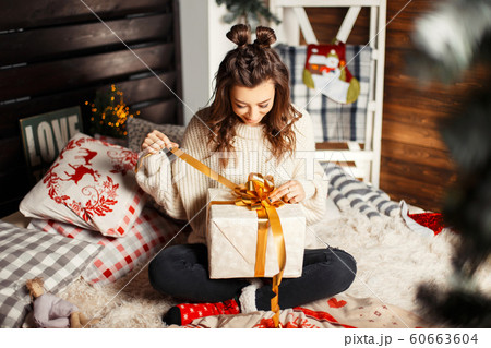 Happy young woman in vintage knitted sweater 60663604