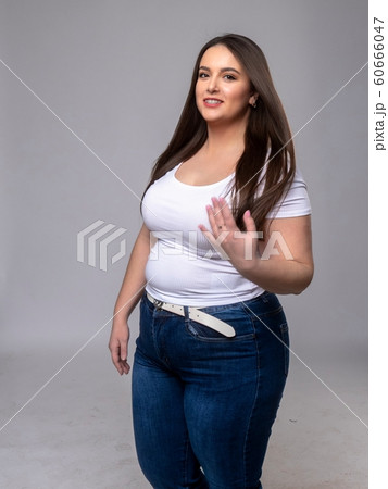 Plus Size Model with long hair in studio Plus Size Model with long hair in studio 60666047