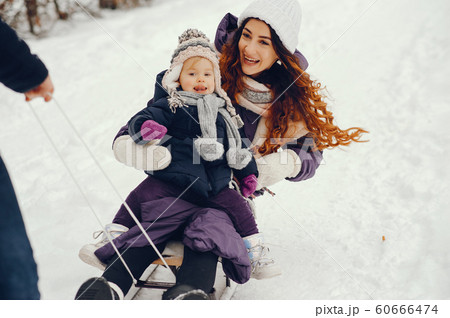 Mother and daughter in a winter park Mother and daughter in a winter park 60666474