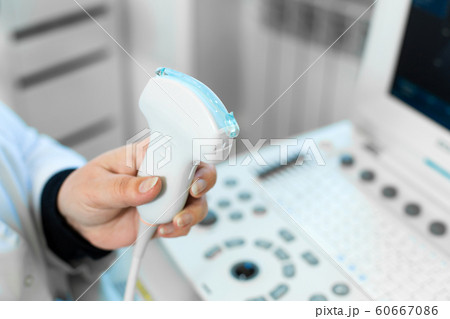 Doctor prepare an ultrasound machine for the 60667086