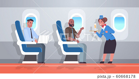 flight attendant serving alcohol drinks to passengers stewardess in uniform holding tray with champagne glass professional service travel concept airplane board interior full length horizontal 60668178