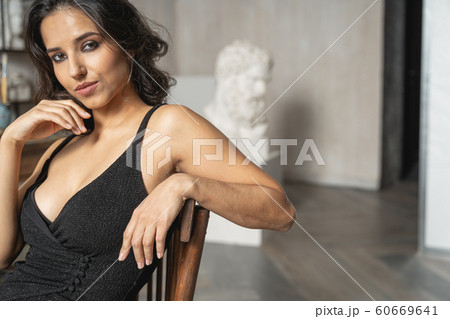 Caucasian attractive woman sitting on chair in art room 60669641