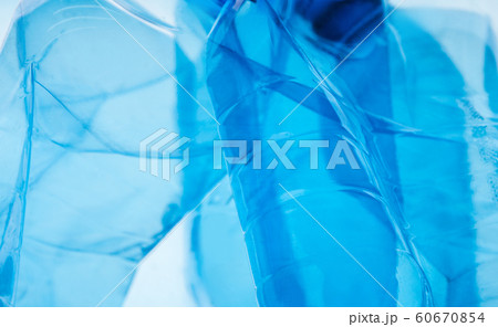 PET plastic Bottles being placed together on white 60670854