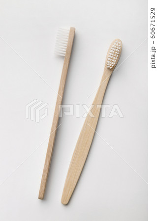 Plastic-free, organic Toothbrushes laying on white background Plastic-free, organic Toothbrushes laying on white background 60671529