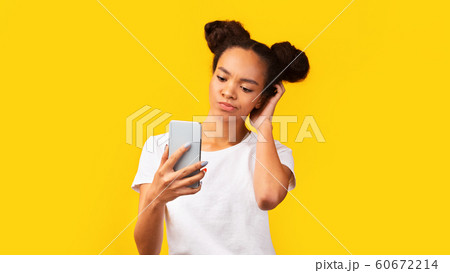 Upset black teenager received disappointing news on feed Upset black teenager received disappointing news on feed 60672214