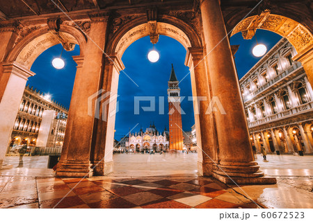 Venice, Italy. Scenic view of Piazza San Marco framed in architectural arches after dusk, blue hour 60672523