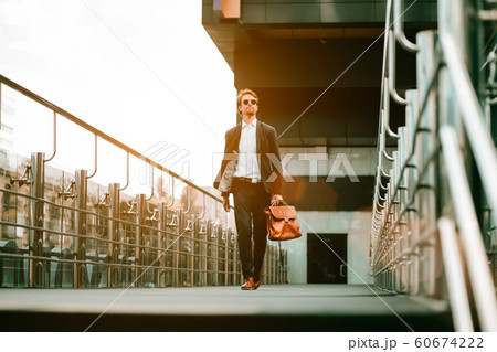 The Man Walking On the Business Center Bridge And Looking Around The Man Walking On the Business Center Bridge And Looking Around 60674222