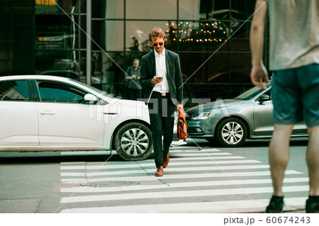 The Businessman Crossing The Road 60674243