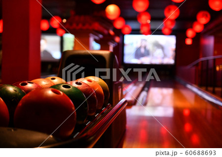 Bowling lane and balls in the row in bowling center. Bowling lane and balls in the row in bowling center. 60688693