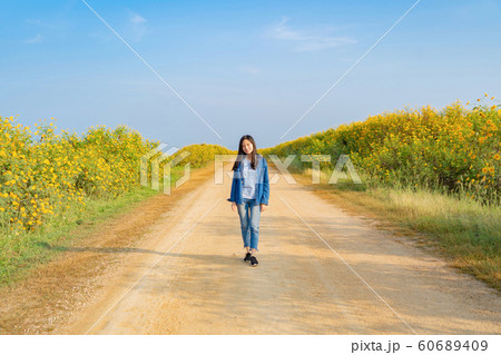 Portrait of happy Asian woman enjoying and Portrait of happy Asian woman enjoying and 60689409