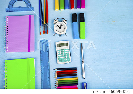 Items for the school on a wooden table. 60696810