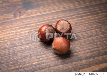 Hazelnuts on a wooden table. Food, snack background 60697003