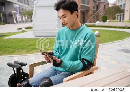Smart mobility life concept, young man using an electric car, electric vehicle 071 Smart mobility life concept, young man using an electric car, electric vehicle 071 60699084