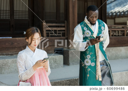 Holidays and tourism concept, group of smiling friends traveling in Seoul, Korea 449 Holidays and tourism concept, group of smiling friends traveling in Seoul, Korea 449 60699486