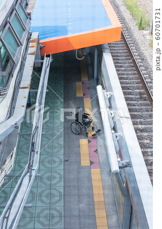 Disabled handicapped man sitting on wheelchair 101 60701731