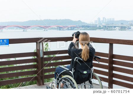Disabled handicapped man sitting on wheelchair 067 60701754